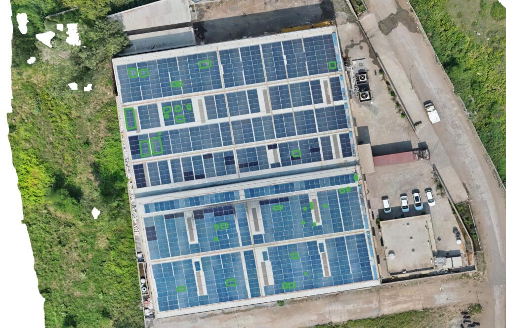 Drone RGB map of the rooftop solar array at Pacific Polycompounds, Ankleshwar, with flagged areas outlined in green.