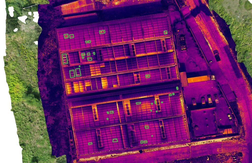 Drone thermal map of the same rooftop solar array, with warmer surfaces shown in yellow and orange.